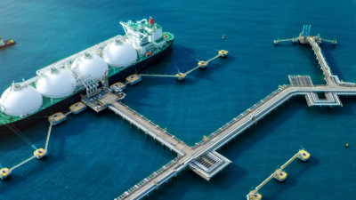 Liquified Natural Gas tanker anchored in Gas terminal gas tanks for storage